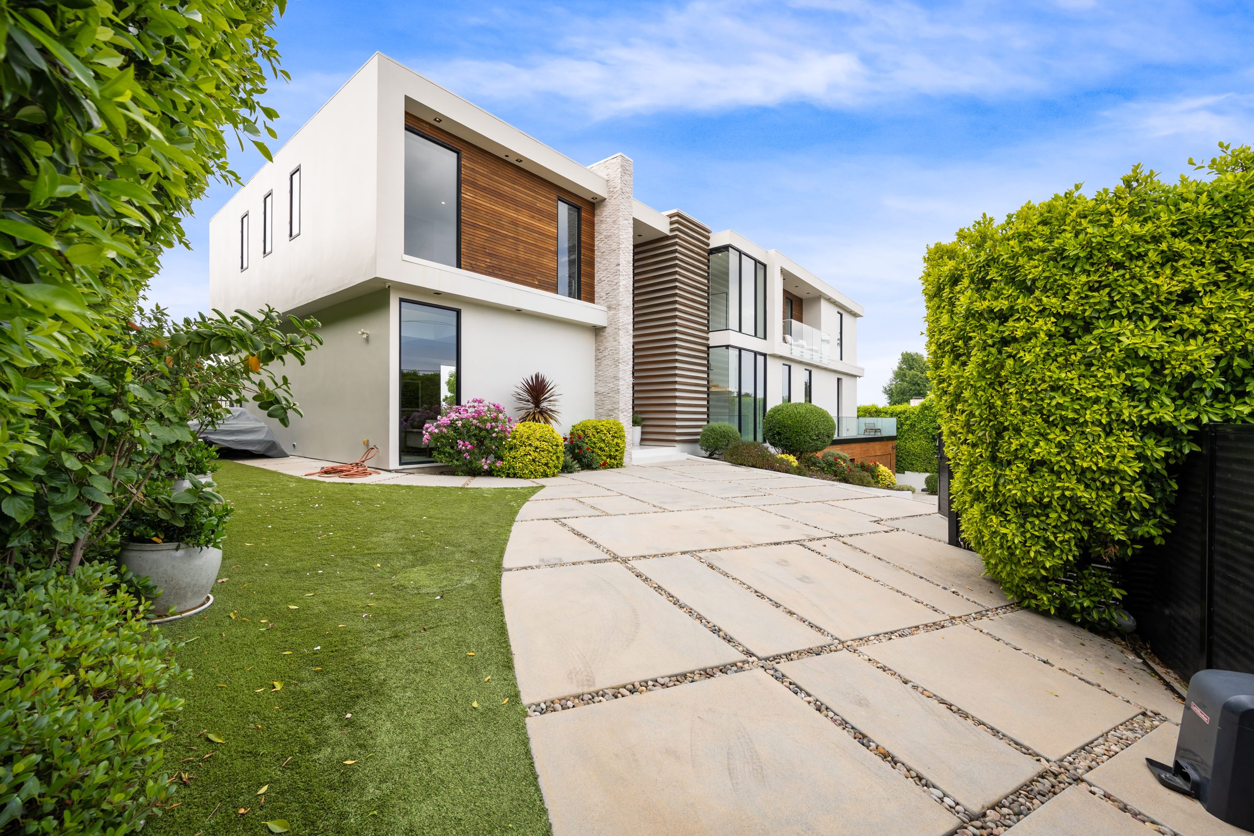 driveway-of-a-contemporary-house-with-a-garden-are-2026-01-08-00-24-21-utc